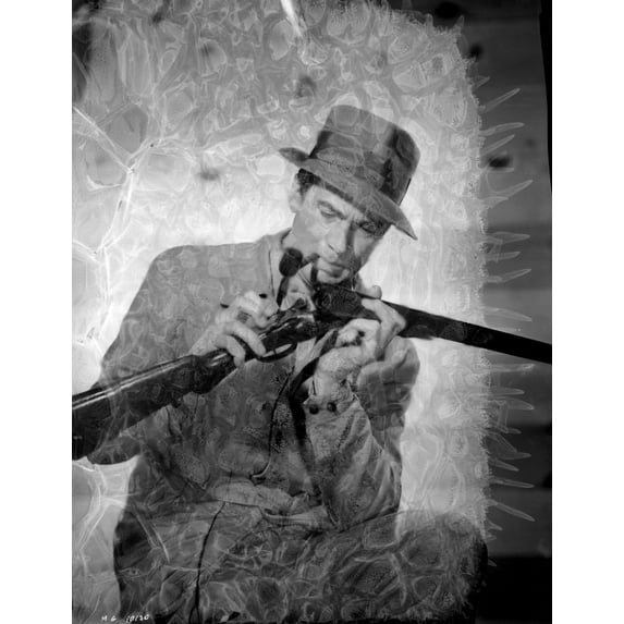 Walter Pidgeon loading a gun Photo Print (24 x 30)