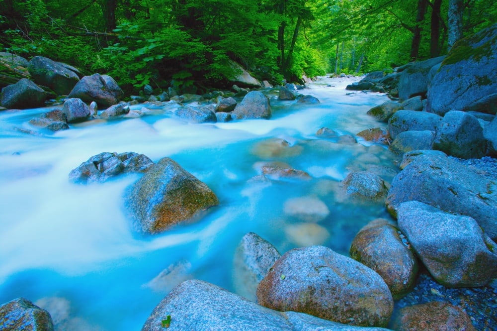 Water Rushing Through Rocks Canvas Art - Don Hammond Design Pics (34 x 22)
