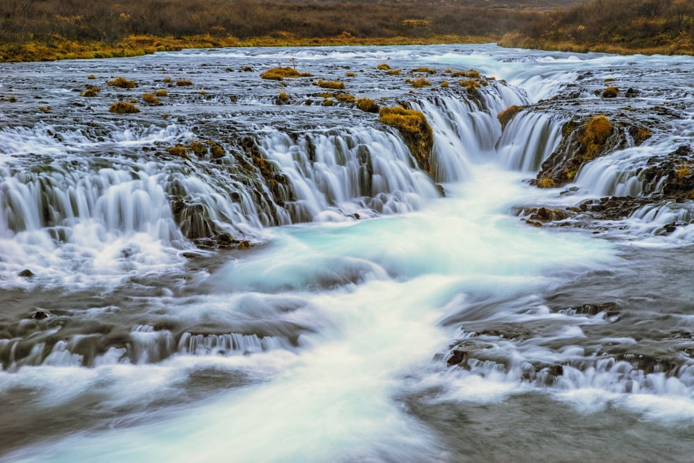 Water cascading over rocks and flowing into a river Bruarfoss Iceland Canvas Art - Robert Postma Design Pics (19 x 12)