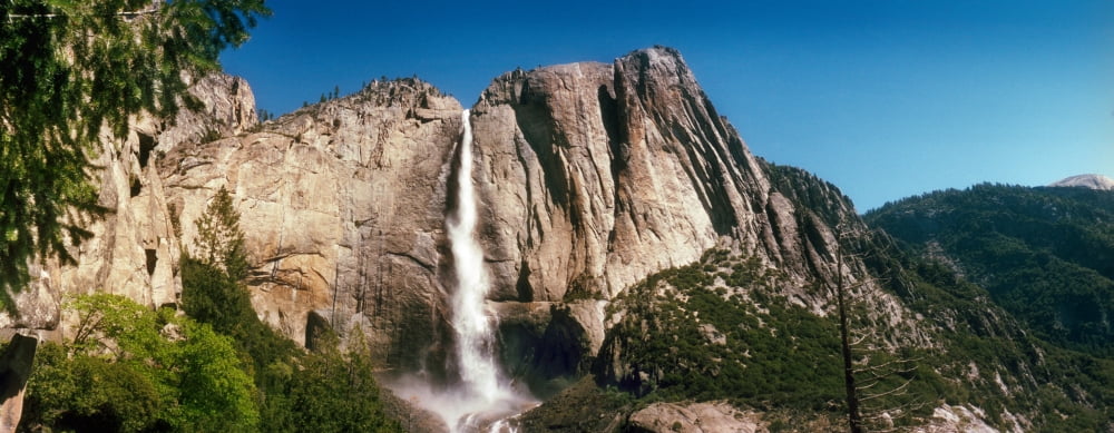 Water falling from rocks in a forest Bridalveil Fall Yosemite Valley Yosemite National Park California USA Canvas Art - Panoramic Images (6 x 15)