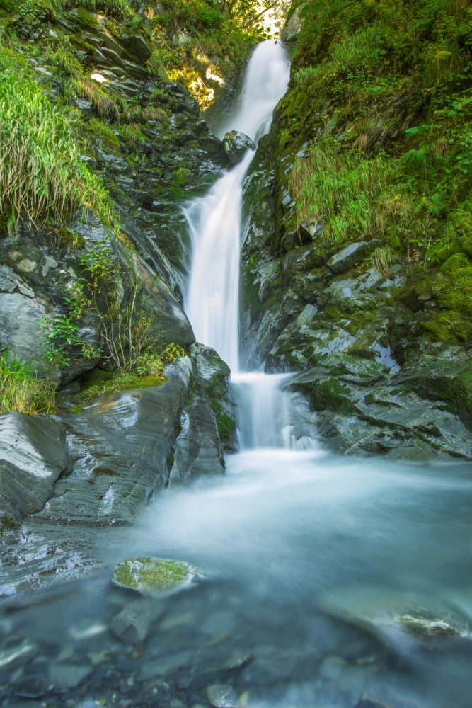 Water flowing down a rugged slope with lush foliage Valdez Alaska United States of America Canvas Art - Zachary Sheldon Design Pics (12 x 19)