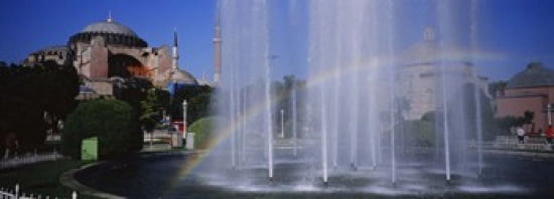 Water fountain with a rainbow in front of museum Hagia Sophia Istanbul Turkey Canvas Art - Panoramic Images (18 x 7)