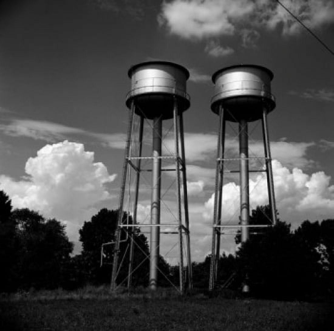 Water tanks against cloudy sky Canvas Art - (24 x 36)