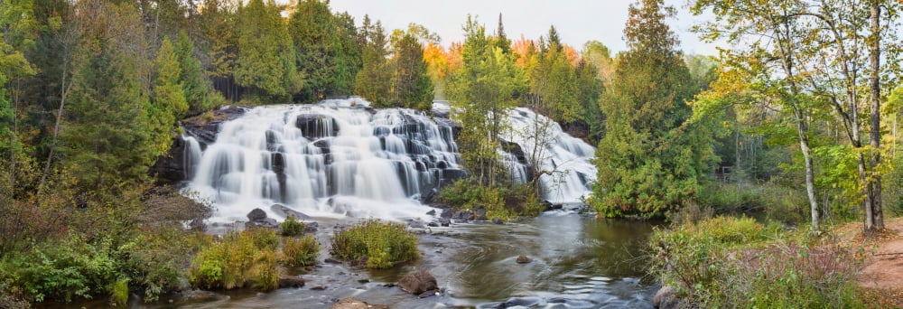 Waterfall in a forest Bond Falls Ontonagon River Ontonagon County Michigan USA Canvas Art - Panoramic Images (13 x 36)