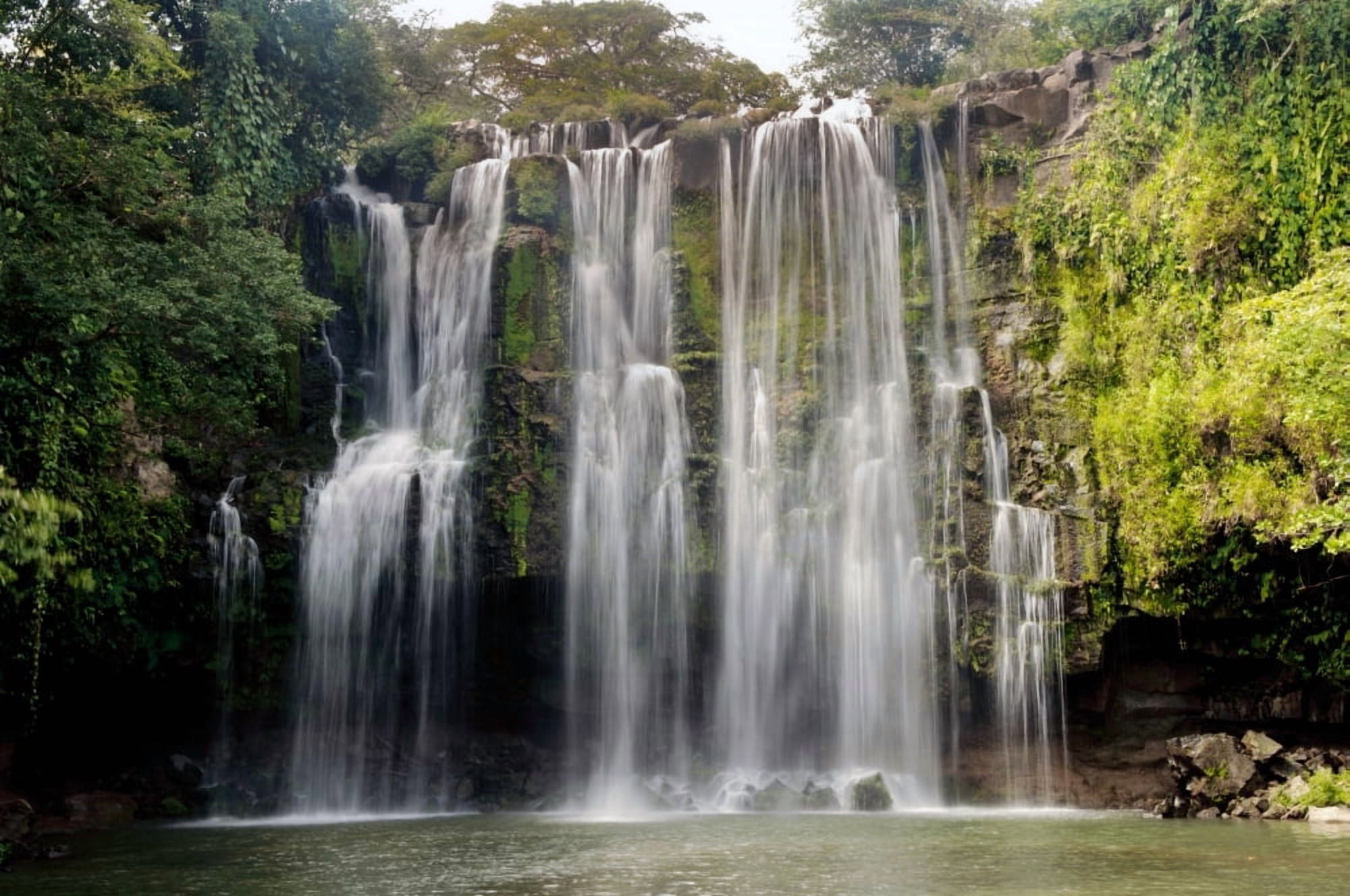 Waterfall in a forest Llanos De Cortez Waterfall La Libertad Gulf Of Papagayo Guanacaste Costa Rica Canvas Art - Panoramic Images (9 x 27)