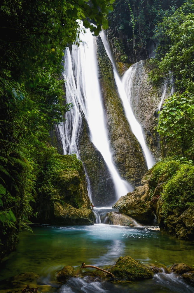 Waterfall over moss covered cliff Tanna Island Vanuatu Canvas Art - David Kirkland Design Pics (12 x 19)