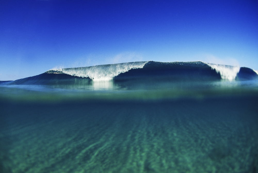 Wave Breaking In Distance Glassy Turqouise Water In Foreground Canvas Art - Liysa Swart Design Pics (38 x 24)
