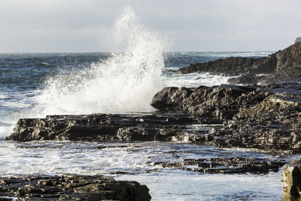 Wave crashing into rocky coast with cloudy sky Kilkee County Clare Ireland Canvas Art - Michael Interisano Design Pics (19 x 12)