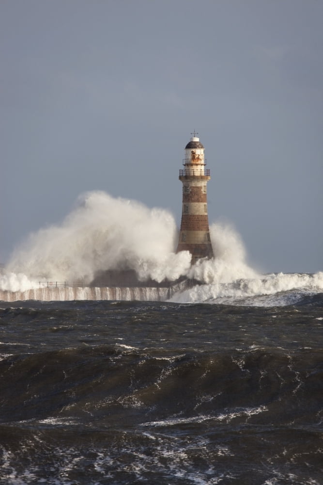 Waves Crashing Against A Lighthouse Sunderland Tyne And Wear England Canvas Art - John Short Design Pics (24 x 38)