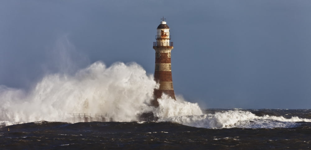 Waves Crashing Against A Lighthouse Sunderland Tyne And Wear England Canvas Art - John Short Design Pics (44 x 20)