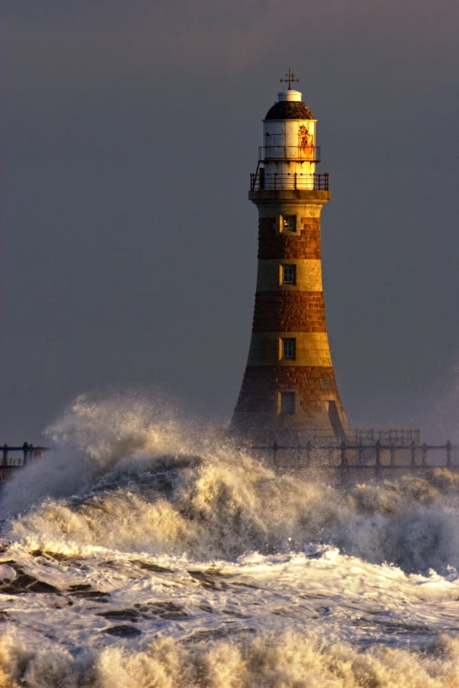 Waves Crashing Against A Lighthouse Tyne And Wear England Canvas Art - John Short Design Pics (22 x 34)