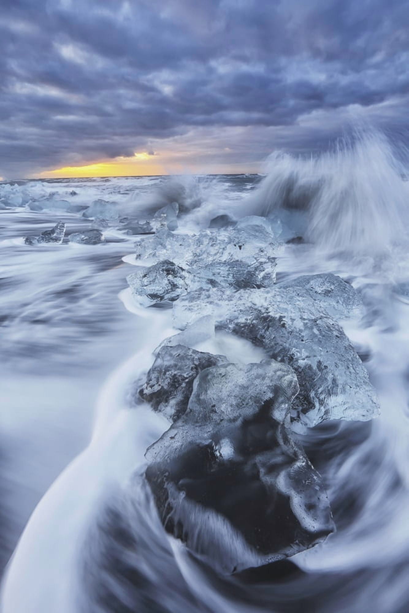 Waves from the atlantic ocean crash into ice calf from breioamerkurjokull a glacial tongue of the vatnajokull ice cap iceland Canvas Art - Robert Postma Design Pics (12 x 19)