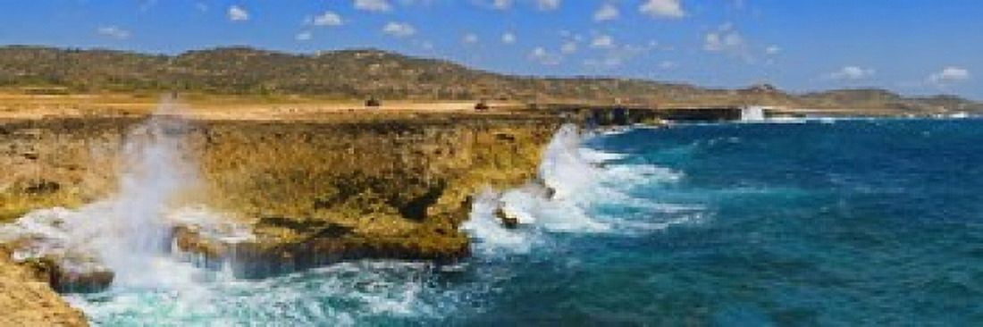 Waves breaking at the coast Aruba Canvas Art - Panoramic Images (18 x 6)