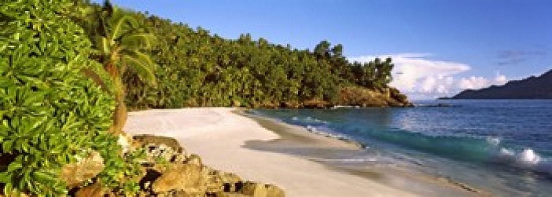 Waves breaking on a small secluded beach on North Island Seychelles Canvas Art - Panoramic Images (18 x 7)