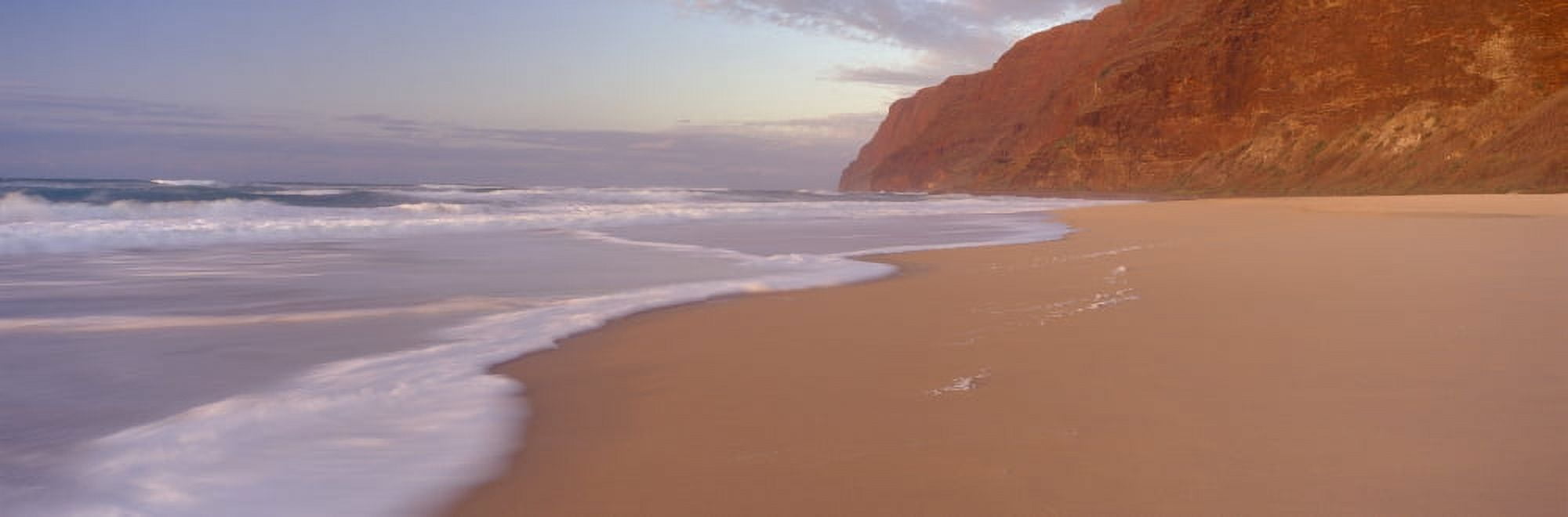 Waves breaking on sandy Barking Sands beach with the Na Pali coast in the background in the evening Kauai Hawaii Canvas Art - Panoramic Images (27 x 9)
