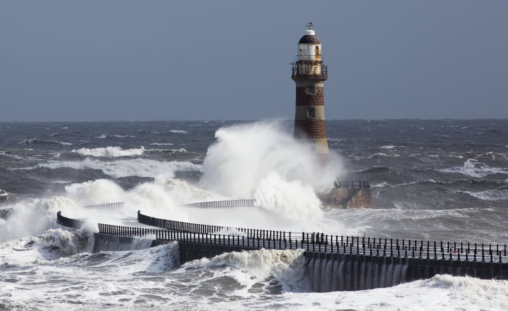 Waves crashing into a lighthouse on the coastSunderland Tyne and Wear England Canvas Art - John Short Design Pics (19 x 12)