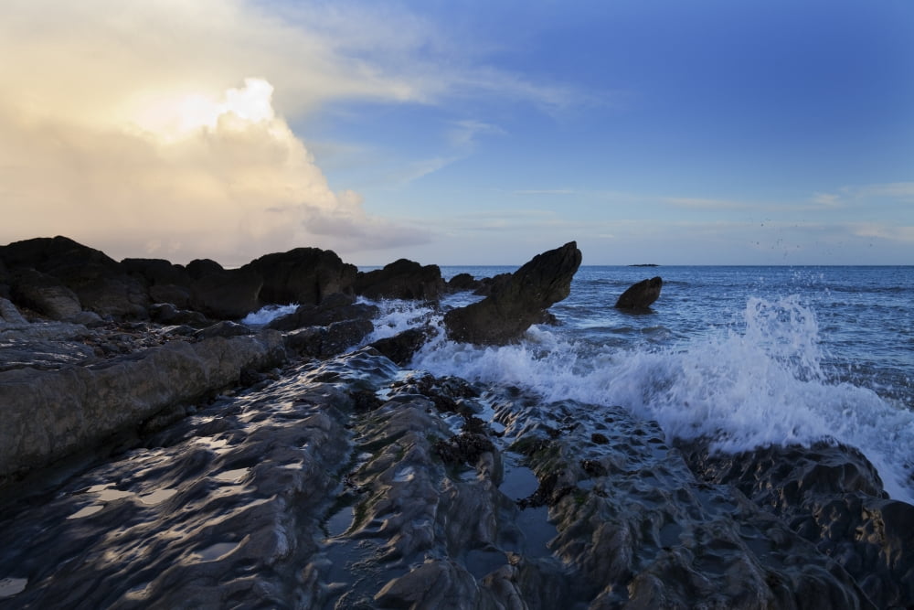 Waves and rocks near Ballinacourty Lighthouse at the entrance to Dungarvan Bay County Waterford Ireland Canvas Art - George Munday Design Pics (38 x 24)