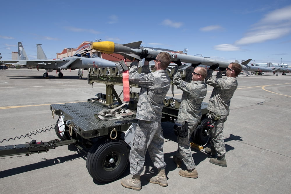 Weapons crew prepare to load an AIM-9X missile on an F-15 Eagle Canvas Art - HIGH-G ProductionsStocktrek Images (18 x 12)
