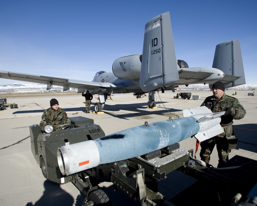 Weapons crews load a GBU-12 laser guided bomb onto an A-10 Thunderbolt Canvas Art - HIGH-G ProductionsStocktrek Images (16 x 13)