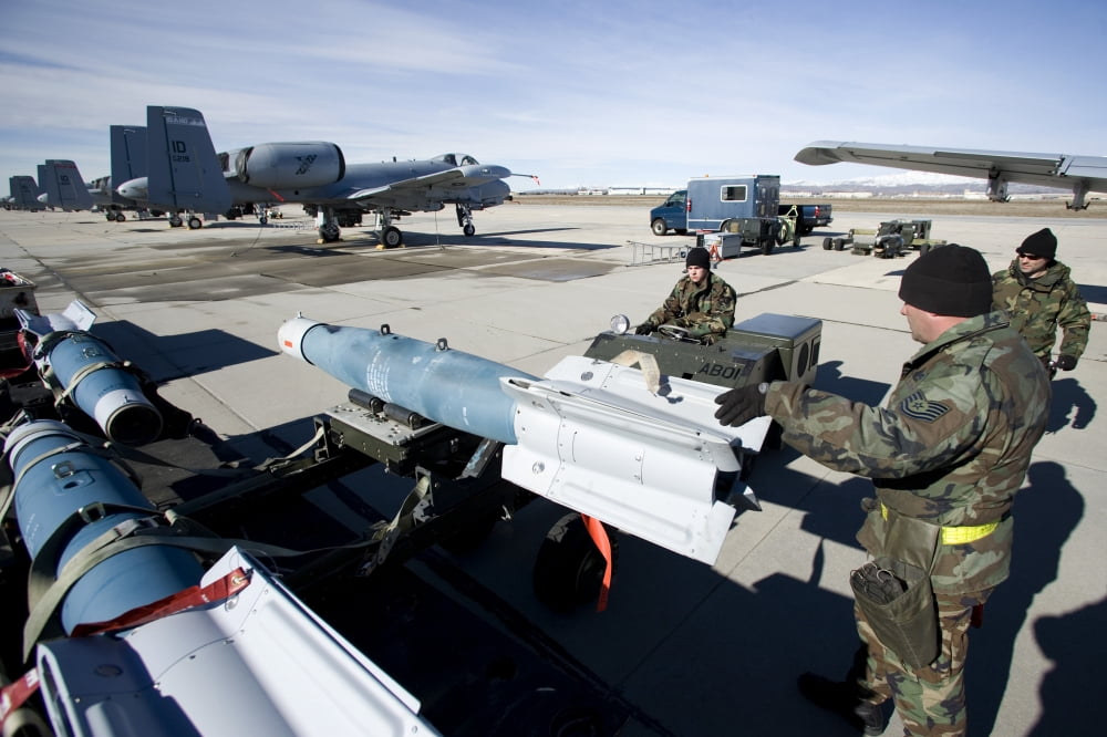 Weapons crews load a GBU-12 laser guided bomb onto an A-10 Thunderbolt Canvas Art - HIGH-G ProductionsStocktrek Images (18 x 12)