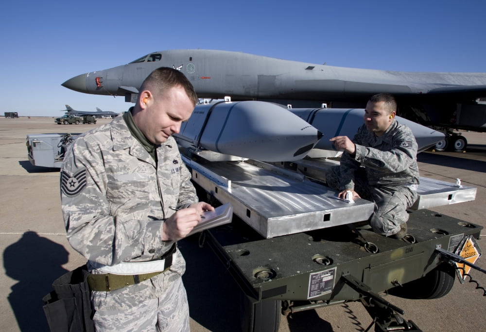 Weapons loaders inspect an AGM-158 JASSM Canvas Art - HIGH-G ProductionsStocktrek Images (35 x 24)