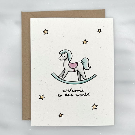 Welcome to the World Greeting Card featuring a cute rocking horse illustration, suitable for a new baby or baby shower, includes a kraft brown envelope.