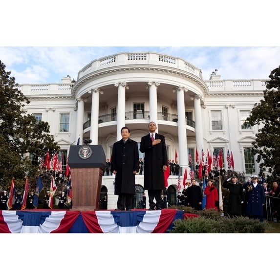 Welcoming Ceremony For Chinese President Hu Jintao On The South Lawn Of The White House. President Obama Salutes During
