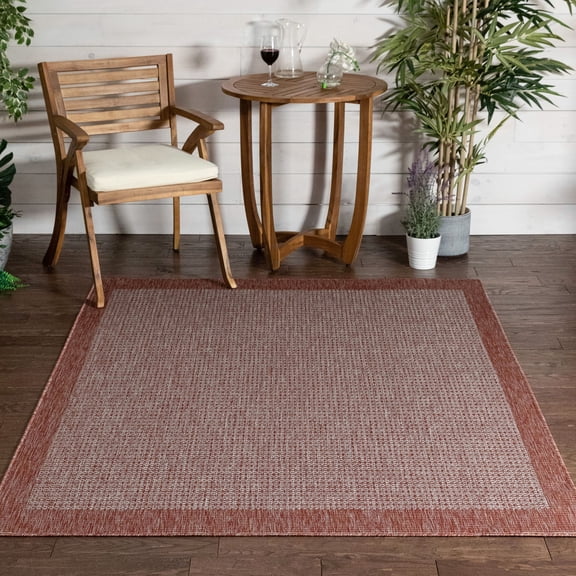 Well Woven Woden Coral Pink Indoor/Outdoor Solid Color Border Area Rug (9'3" x 12'6")