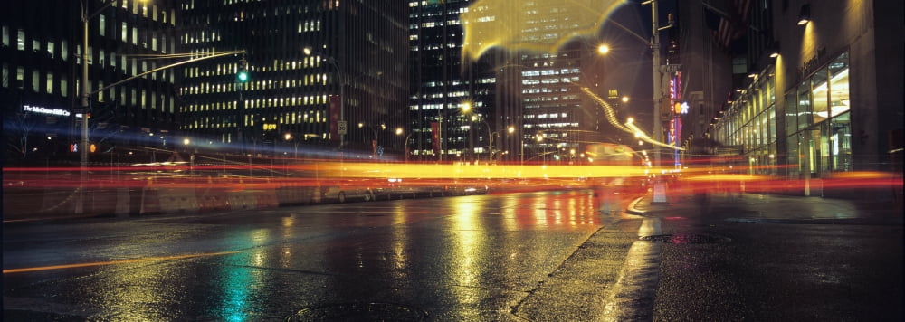 Wet Sidewalks And Traffic On 6Th Avenue Canvas Art - Marc Jackson Design Pics (26 x 9)
