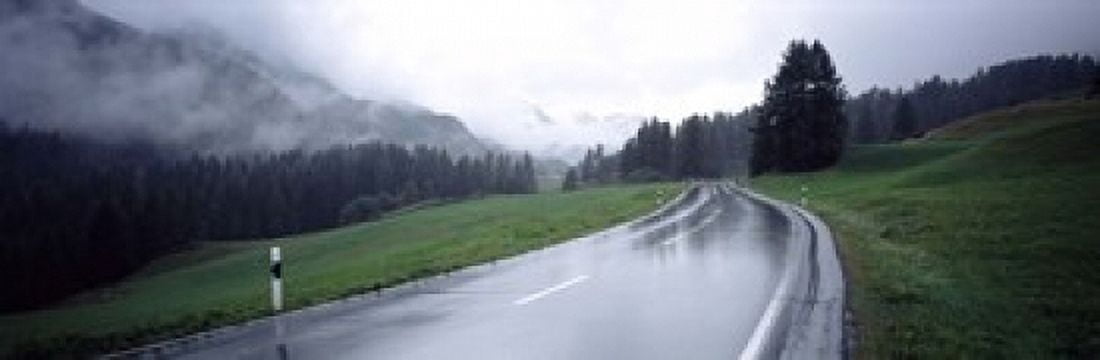 Wet highway passing through a forest Austria Canvas Art - Panoramic Images (18 x 6)