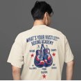 thumbnail image 1 of What's Your Hustle? Boxing Academy BOXY T-Shirt | Choose Solutions | 2 Colors, 1 of 6