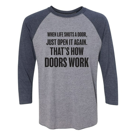 When Life Shuts A Door. . Open It Unisex 3/4 Sleeve Baseball Raglan Tee