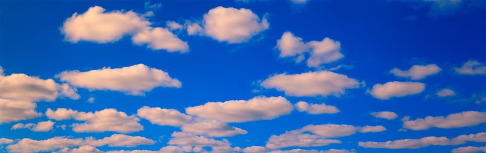 White Clouds in Blue Sky Canvas Art - Panoramic Images (27 x 9)