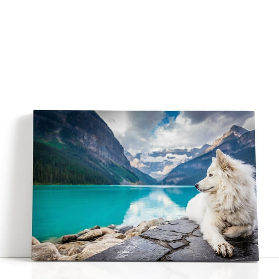 White Fox Sitting On A Lakefront Near Mountains - Wrapped Canvas Print Wall Art | 18" W x 12" H