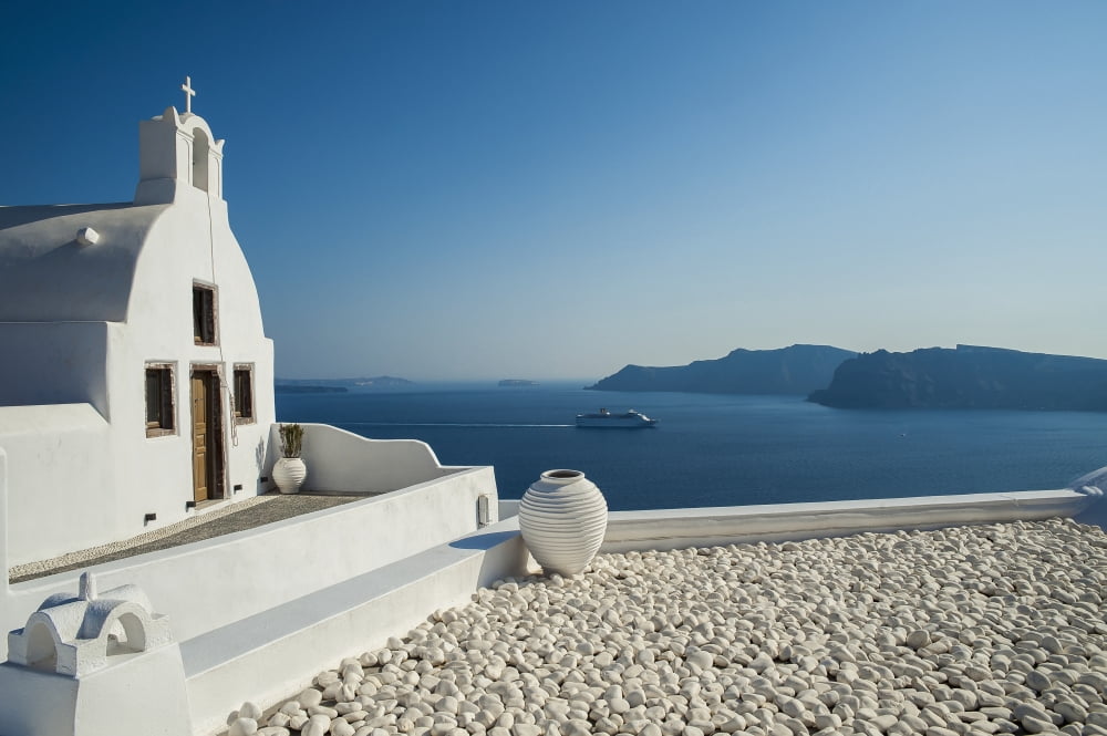 White church on the waters edge Oia Santorini Greece Canvas Art - Dosfotos Design Pics (19 x 12)