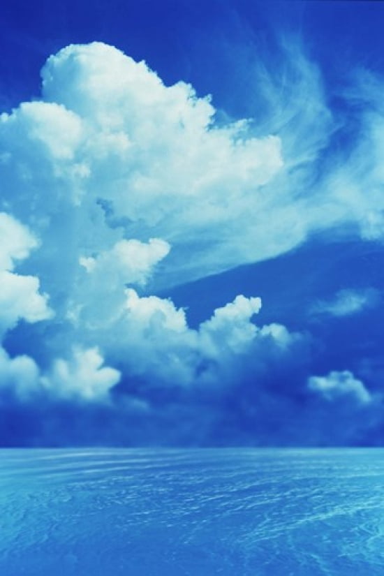 White clouds in dark blue sky over rippling water Canvas Art - Panoramic Images (24 x 36)