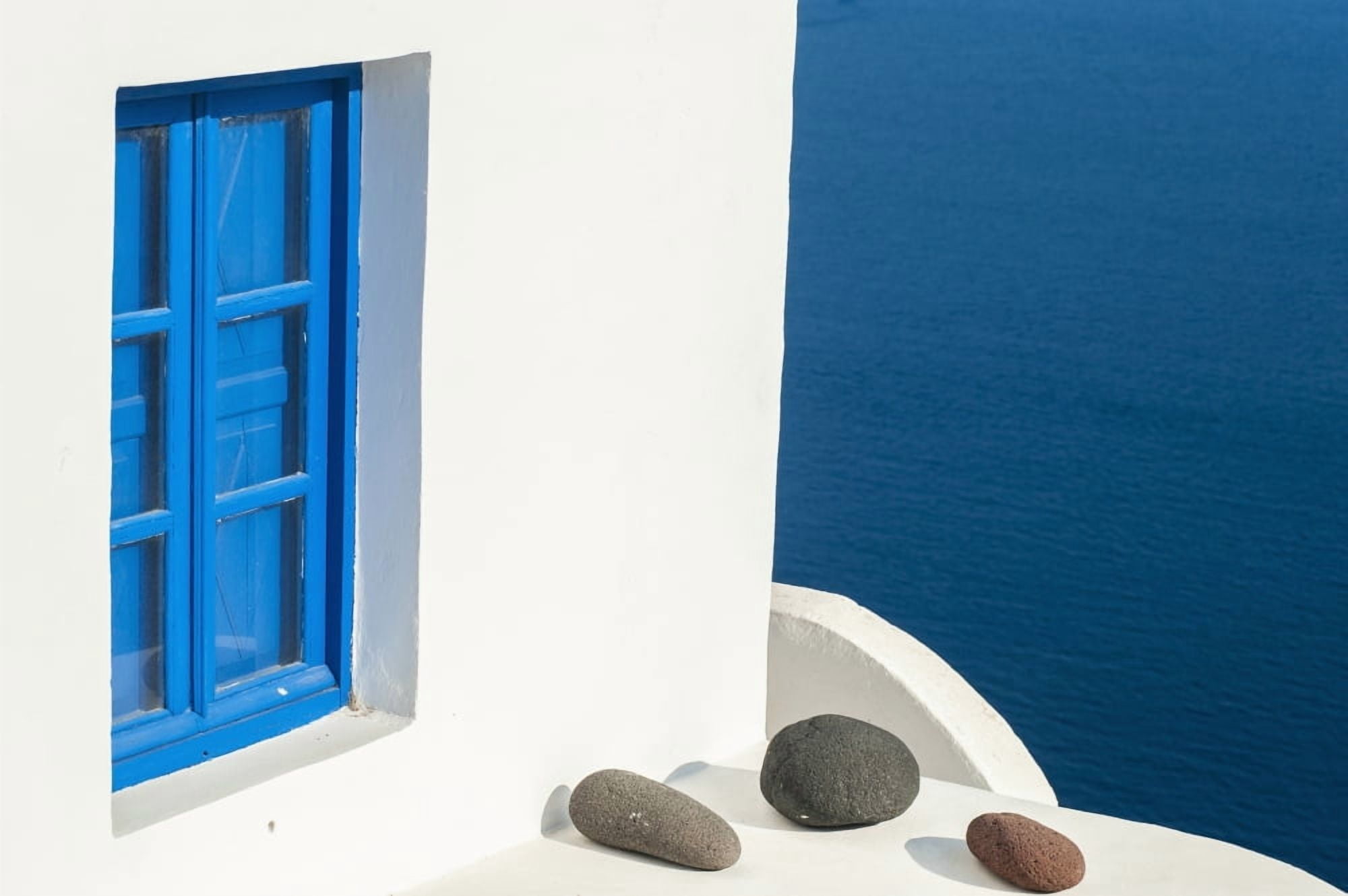 Whitewash building with blue trimmed window along the Aegean sea Oia Santorini Greece Canvas Art - Dosfotos Design Pics (19 x 12)