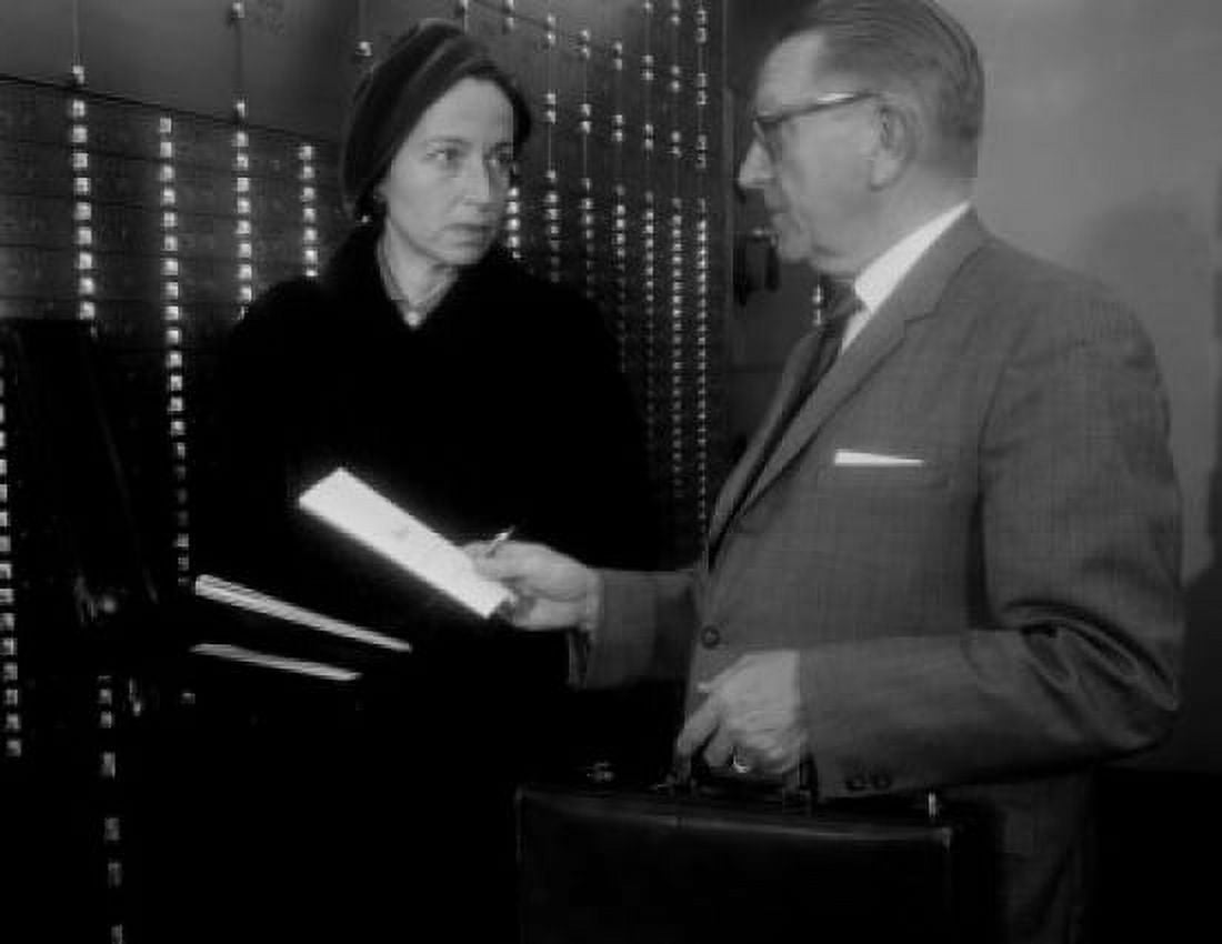 Widow and her attorney going over contents of safe deposit box Canvas Art - (18 x 24)