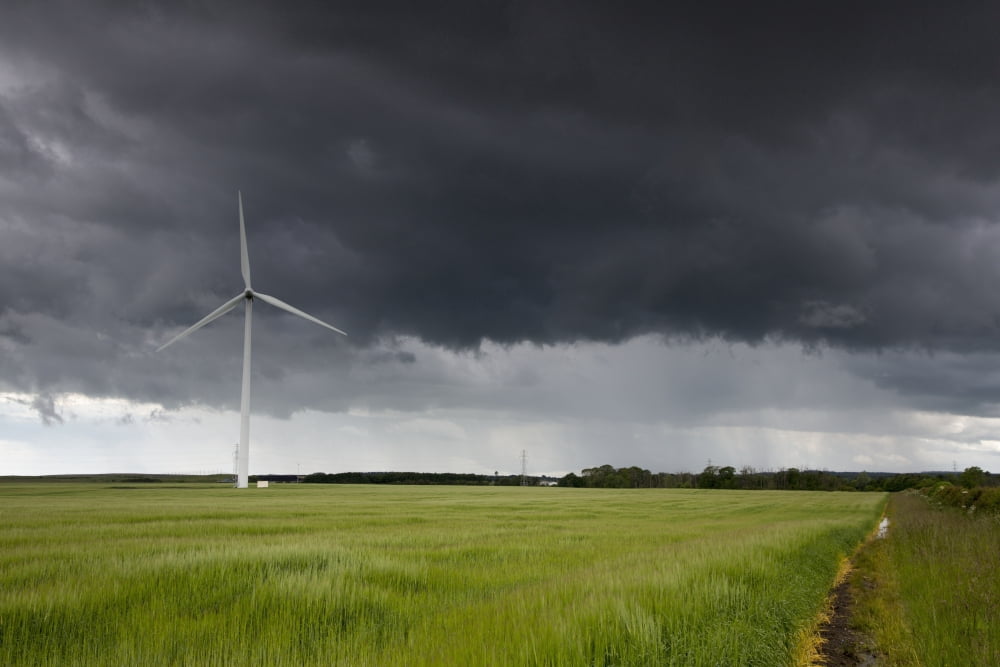 Wind turbine and storm cloudsNorthumberland england Canvas Art - John Short Design Pics (38 x 24)