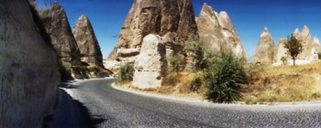 Winding road passing through rocks Cappadocia Central Anatolia Region Turkey Canvas Art - Panoramic Images (30 x 12)