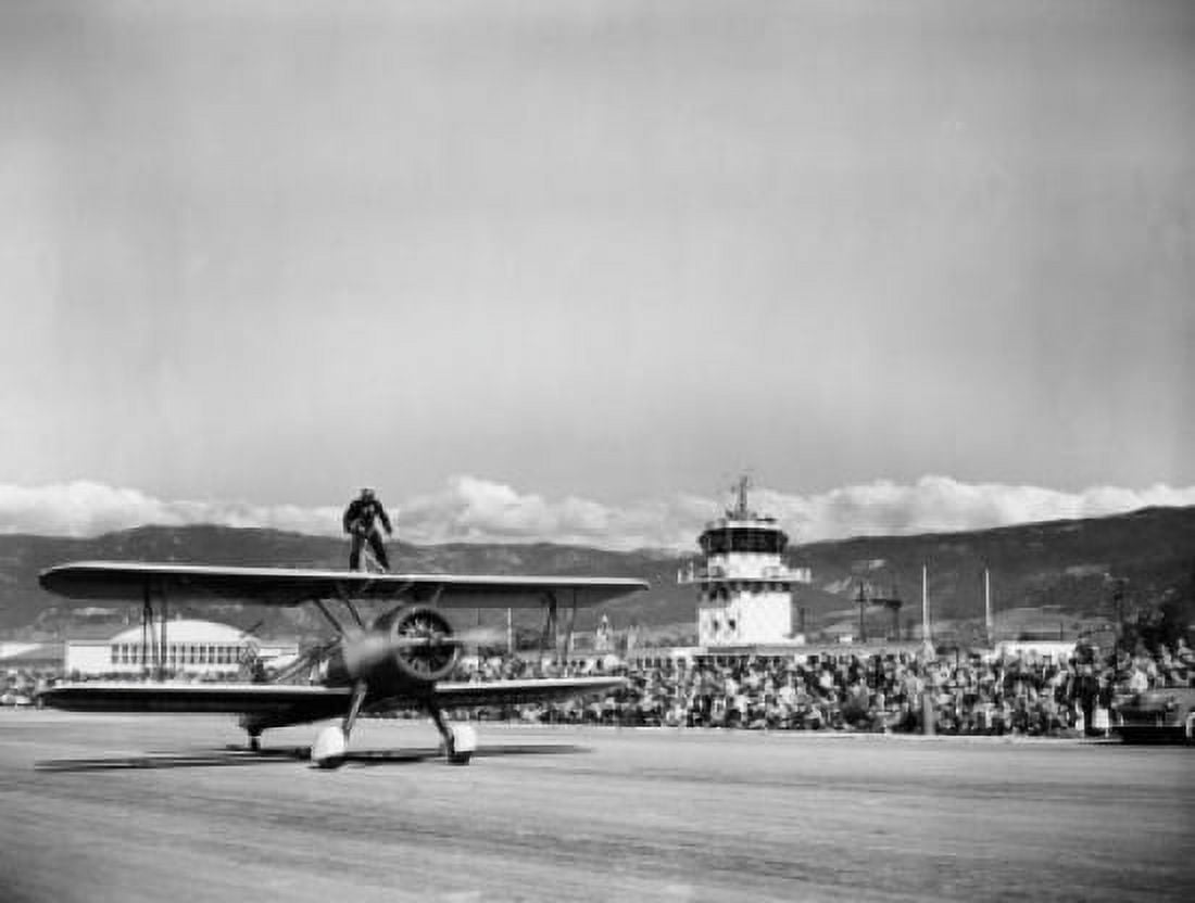 Wing walker standing on top of aircraft Canvas Art - (18 x 24)