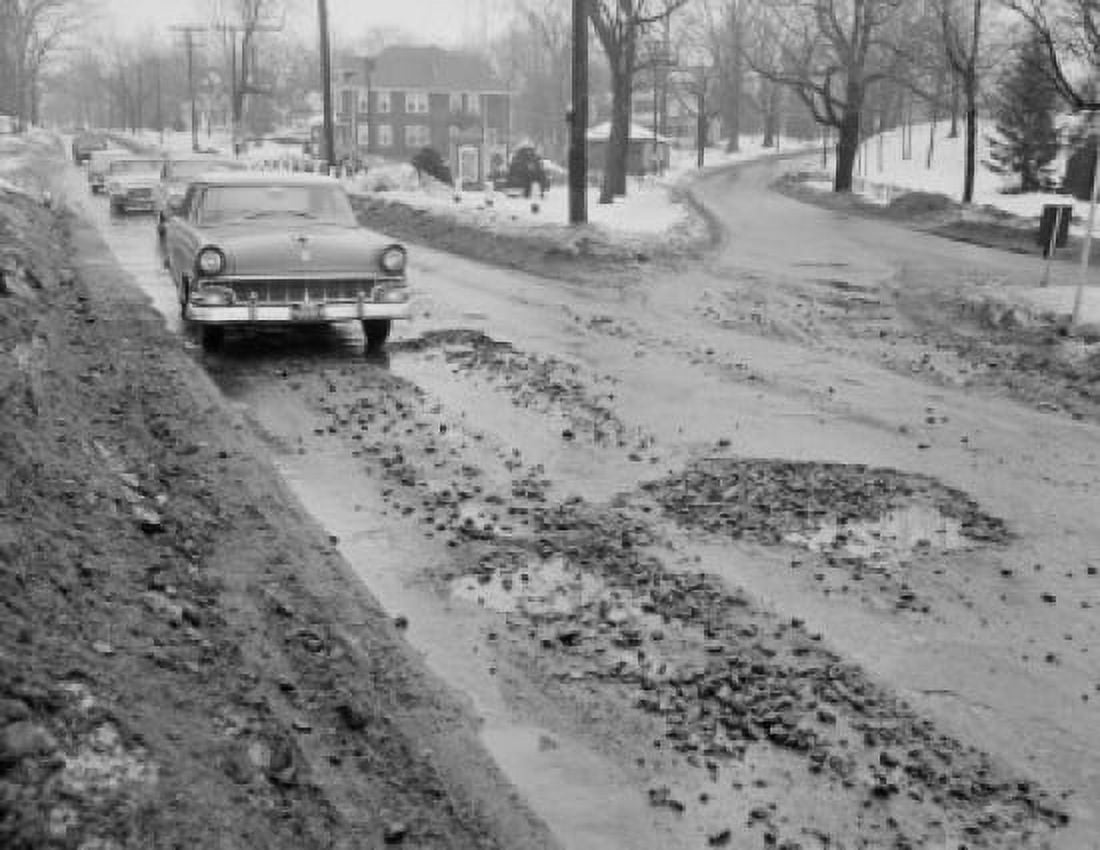 Winter street full of holes snow on street traffic Canvas Art -  (24 x 36)