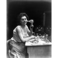 thumbnail image 1 of Woman And Vibrator C1909. Na Woman Demonstrating An Electric Hand Vibrator By Applying It To Her Cheek. Photograph, 1 of 3