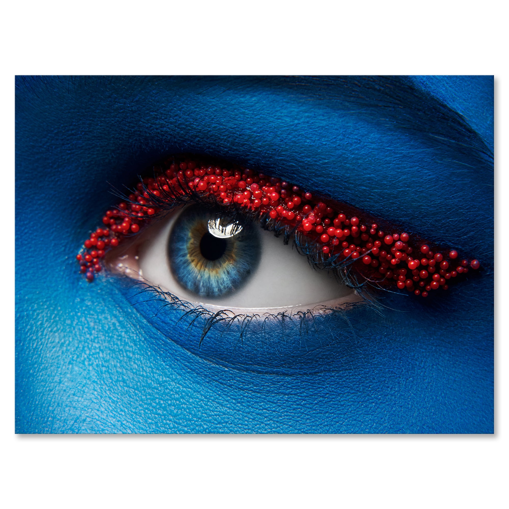 Woman Eye With Blue Paint On Face & Red Balls 12 in x 8 in Photography Canvas Art Print, by Designart
