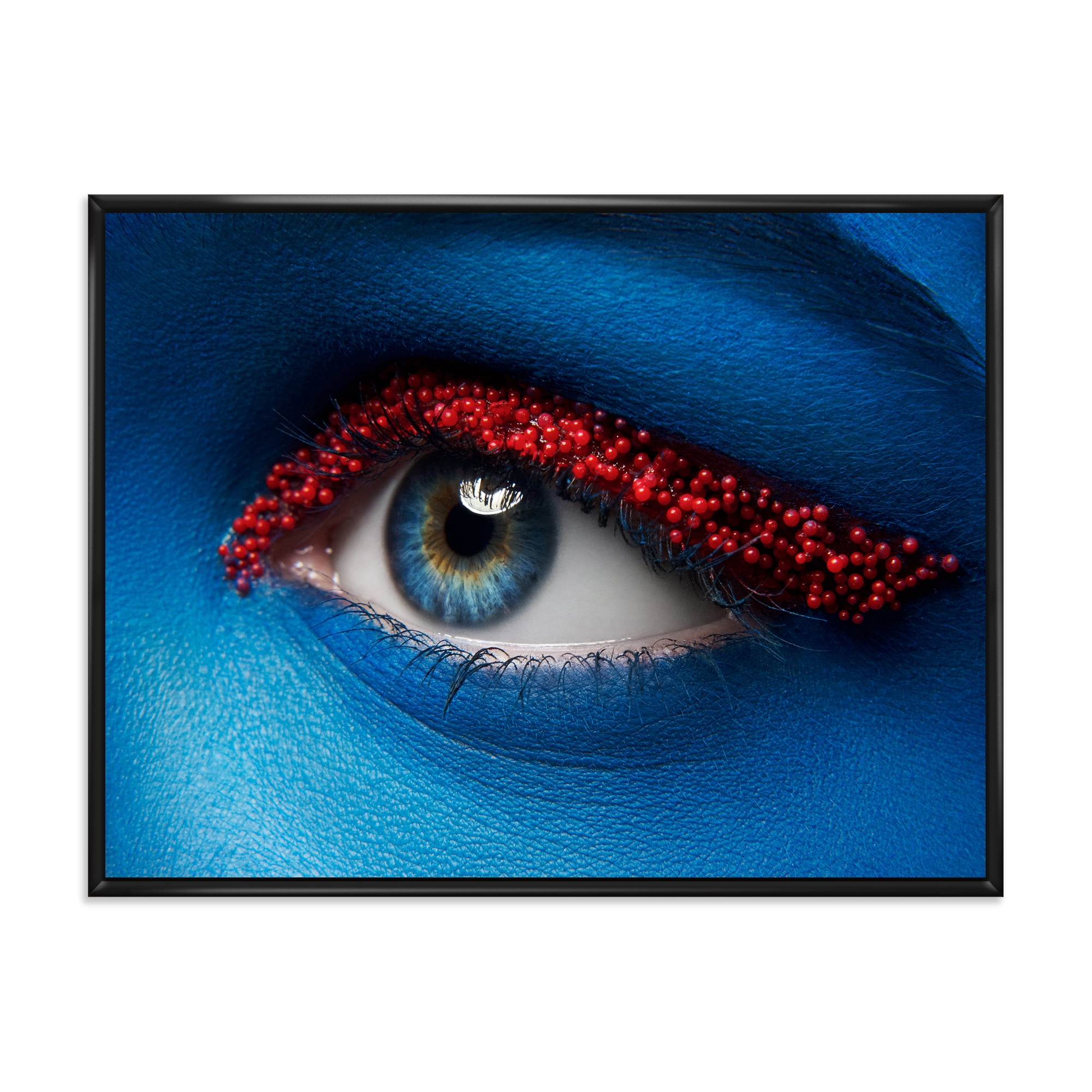 Woman Eye With Blue Paint On Face & Red Balls 40 in x 30 in Framed Photography Canvas Art Print, by Designart