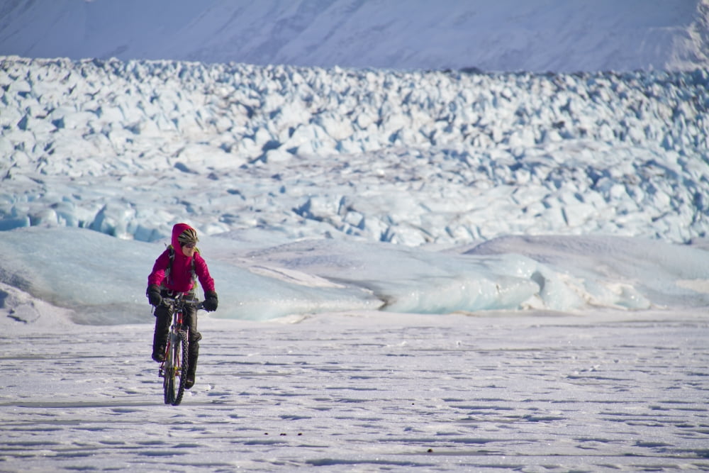 Woman Fat Tire Mountain Biking On The Knik Glacier Chugach Mountains Southcentral Alaska Winter Canvas Art - Joe Stock Design Pics (34 x 22)