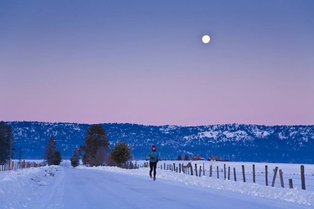 Woman Jogging In Winter On Rural Road At Dawn Near Mccall Idaho Usa Canvas Art - Michael DeYoung Design Pics (17 x 11)