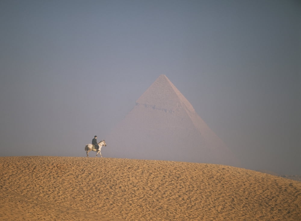 Woman Riding Horse With Great Pyramid Of Chephren Behind Canvas Art - Ian Cumming Design Pics (36 x 26)