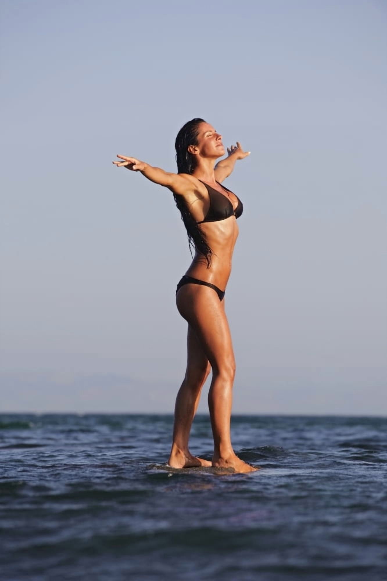 Woman Standing On The Water Canvas Art - Ben Welsh Design Pics (24 x 38)
