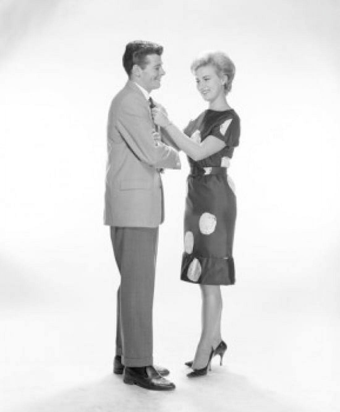 Woman adjusting mans tie Canvas Art - (18 x 24)